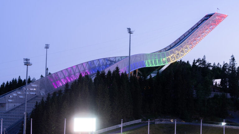 Holmenkollen ski jump in Oslo Pride colours. Photo: Dreamnord / Shutterstock.com.