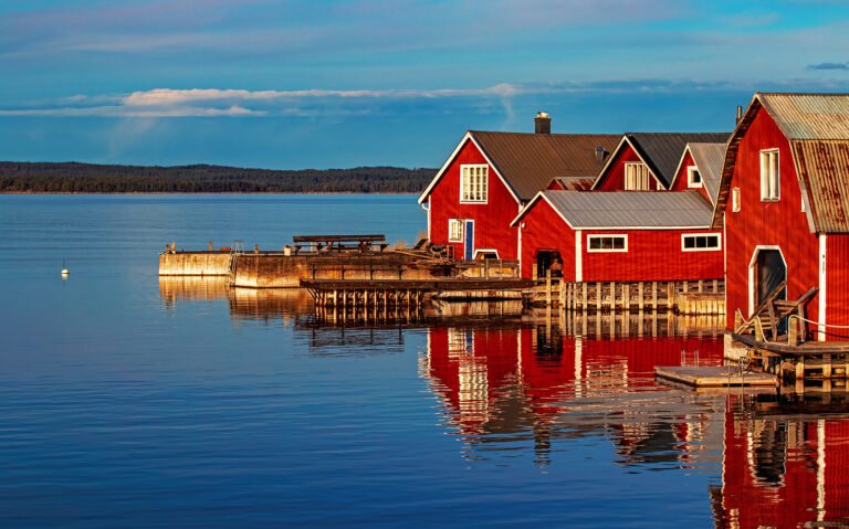 Red cottages by the lake in Sweden, Scandinavia.