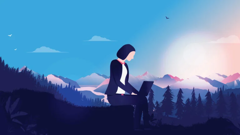 A woman remote working in the Norwegian mountains.