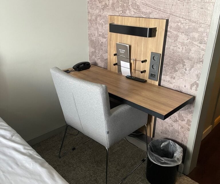 Work desk in the small single hotel room.