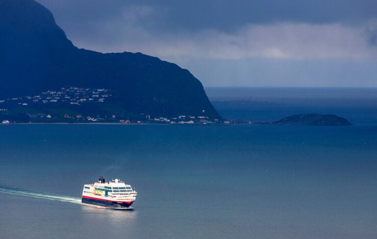 Hurtigruten sailing near the Norwegian coastline.