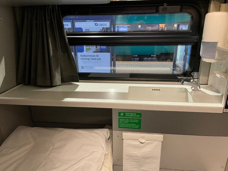 Sink and window in the train sleeping cabin
