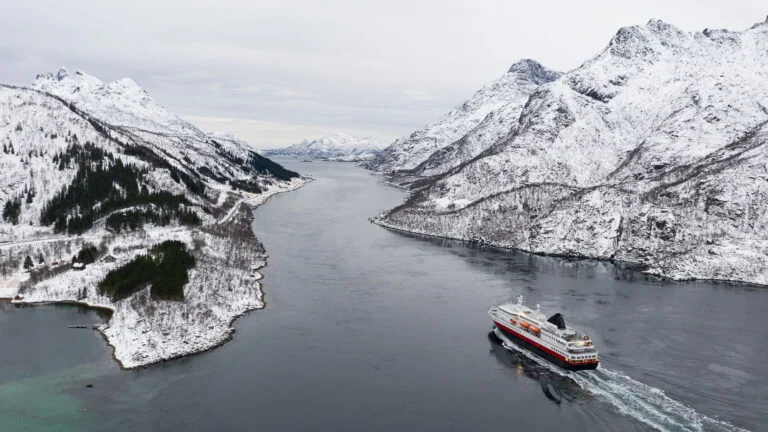 Norway’s Hurtigruten sailing into the Trollfjord in the winter.