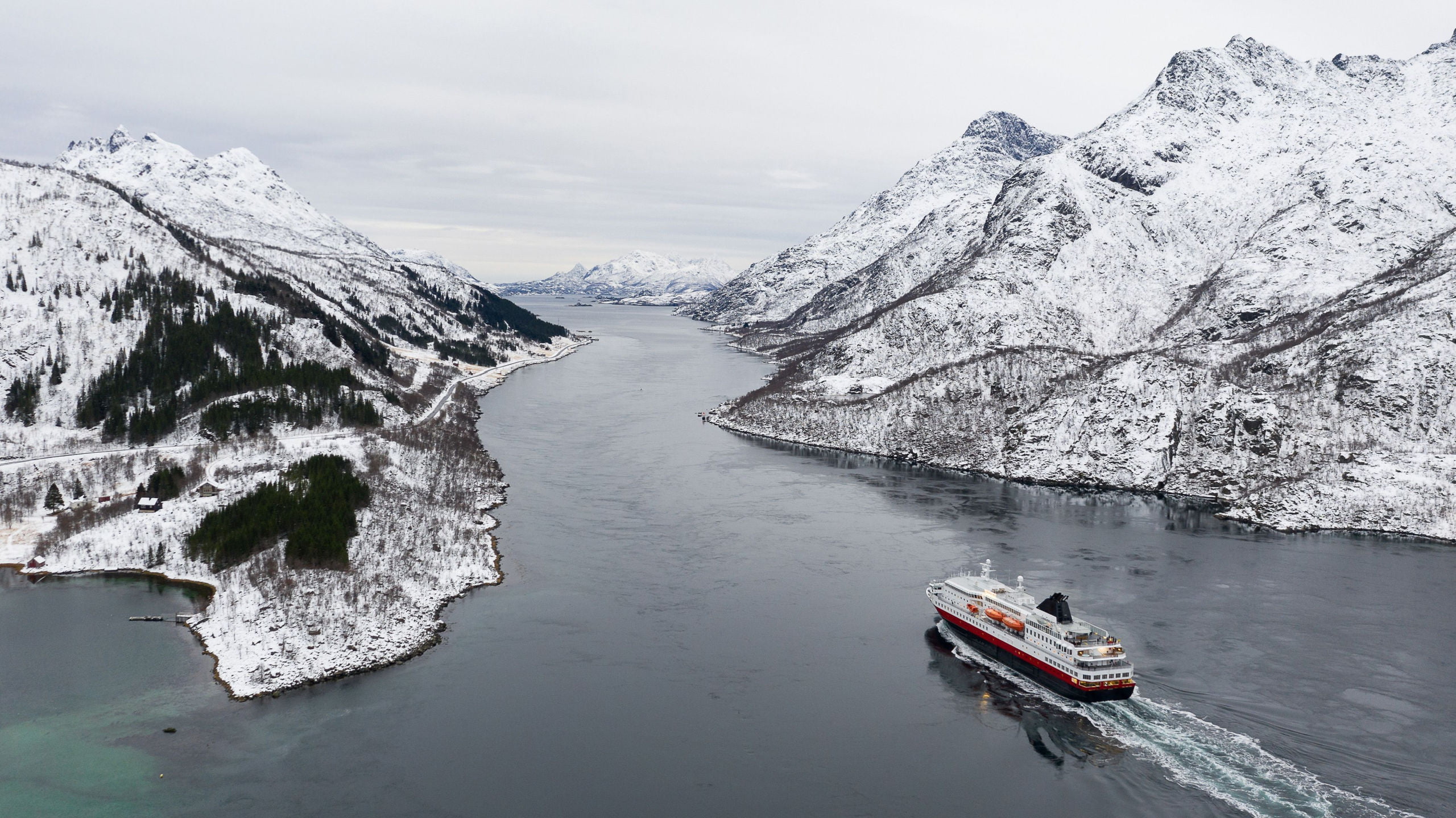 Norway’s Hurtigruten sailing into the Trollfjord in the winter.