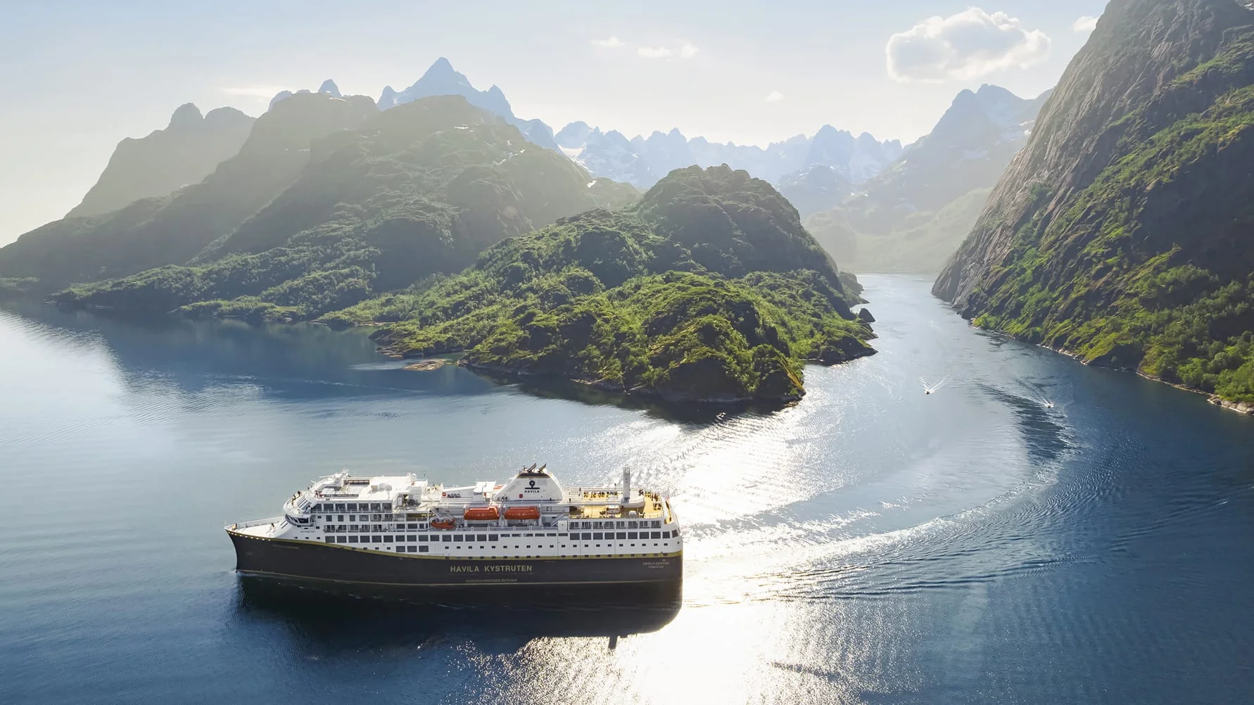 Havila Voyages ship in a Norway fjord.