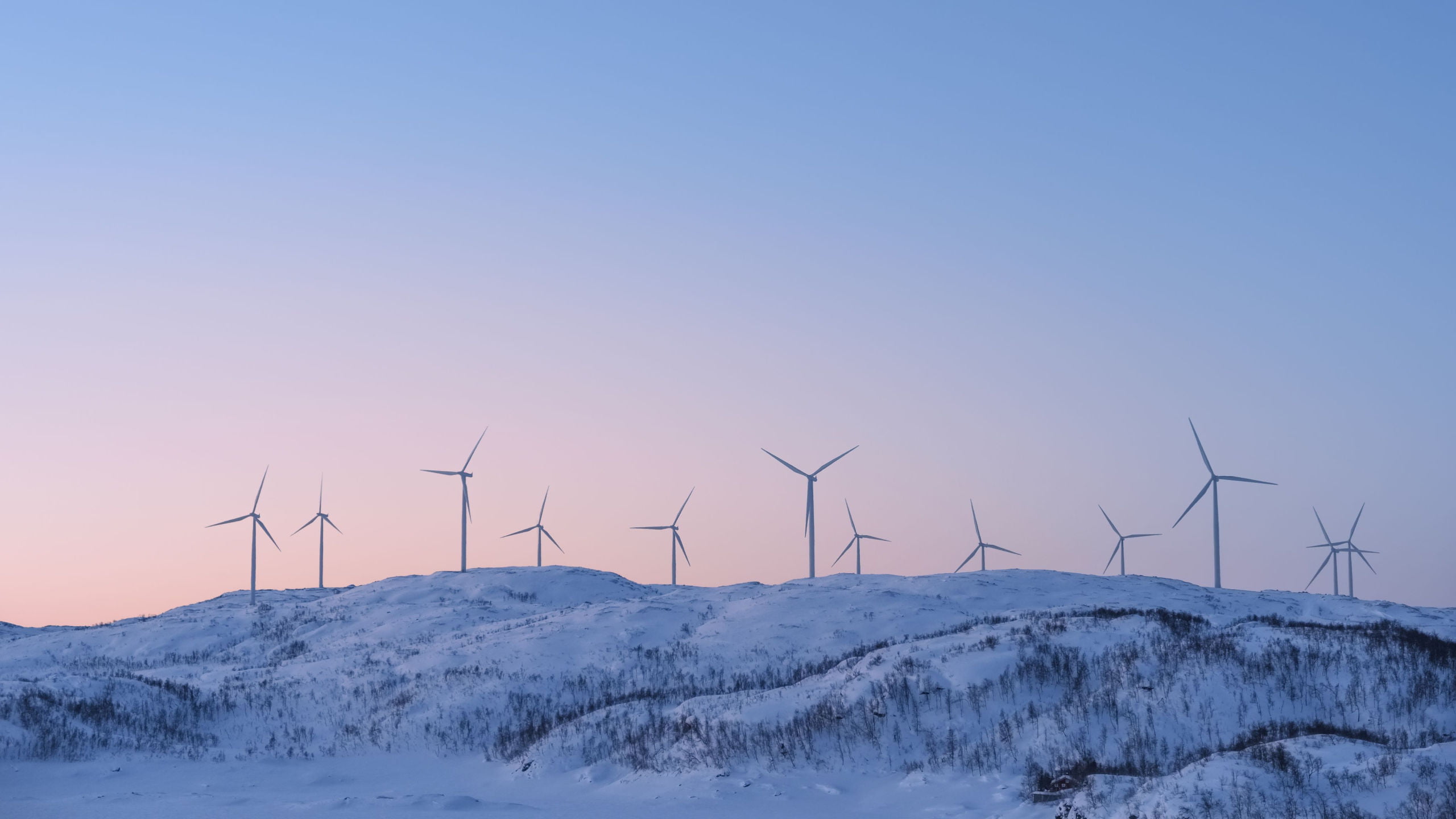 Norway wind farm on snowy mountain.