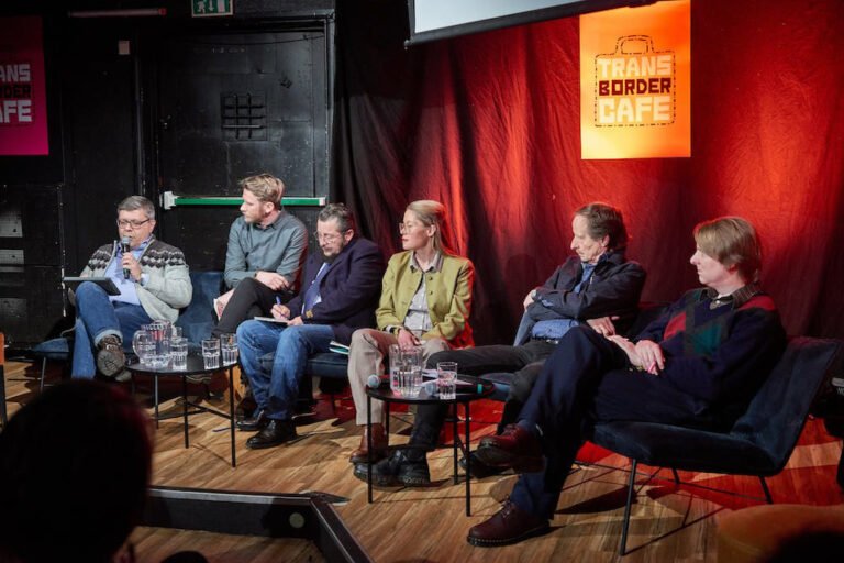 Russian and Norwegian artists in discussion at the Transborder Cafe in Kirkenes. Pikene på Broen/Mikhail Slavin