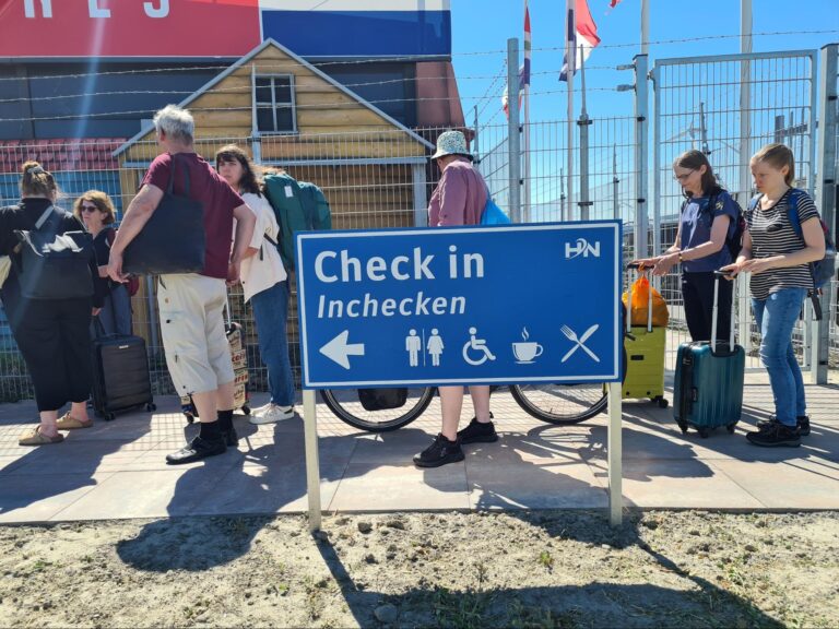 People lining up to check-in for their trip on the Romantika. Photo: Daniel Albert.