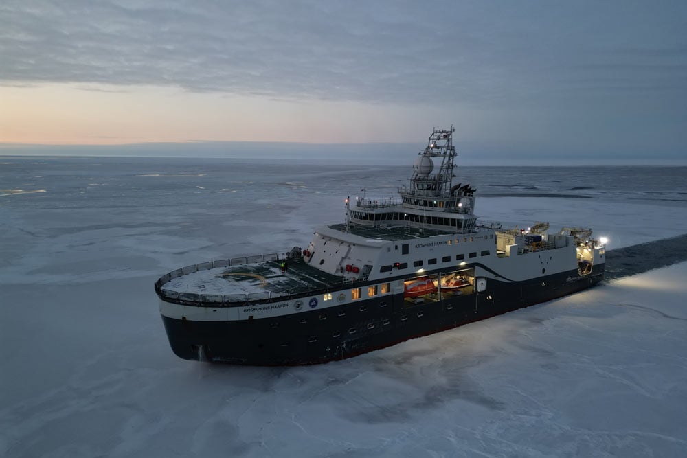 Arctic research ship sailing into the polar night.
