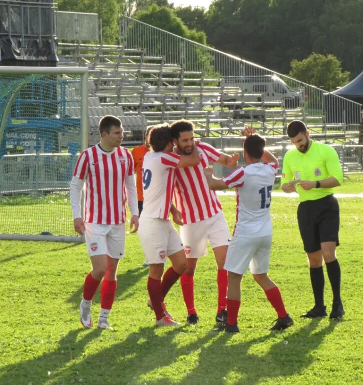 Bislett players celebrate a goal.