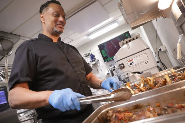 Chef Kenneth Reece prepares to serve the lamb shanks he roasted at a low temperature for five hours. The meat fell off the bone and the combination of flavours was on par with what you would expect at a fine restaurant.