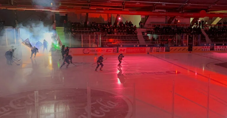 Teams enter the arena