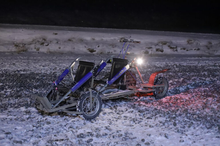 The “sled” has two seats and a standing spot for the driver/musher. When there isn't enough snow, wheeled sleds are used. Photo: Daniel Albert.