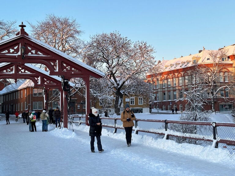 People walking on the old town bridge in the winter.
