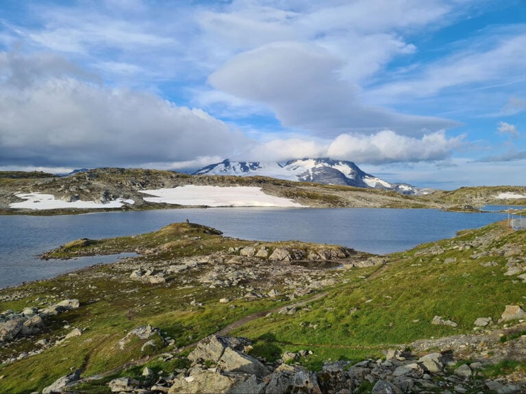 Mountain lakes and glaciers in the distance are a common sight on the Sognefjellet scenic route.
