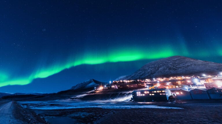 Svalbard winter scene with northern lights.