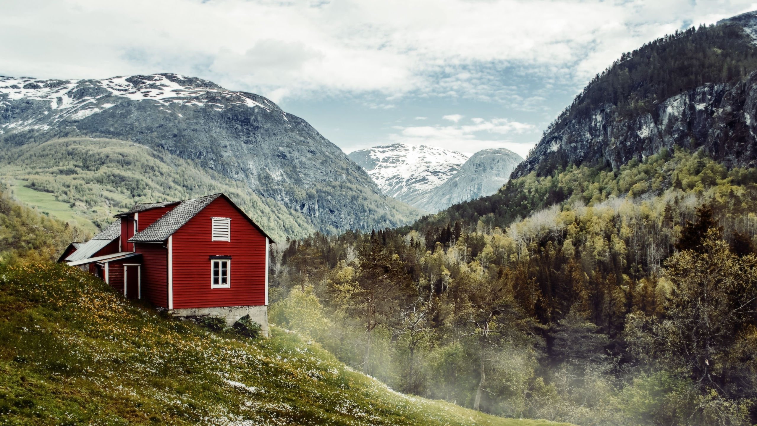 A traditional red, wooden house in rural Norway.