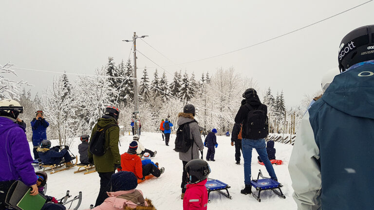 Sledders getting ready to take on Korketrekkeren. Photo: Wirestock Creators / Shutterstock.com.