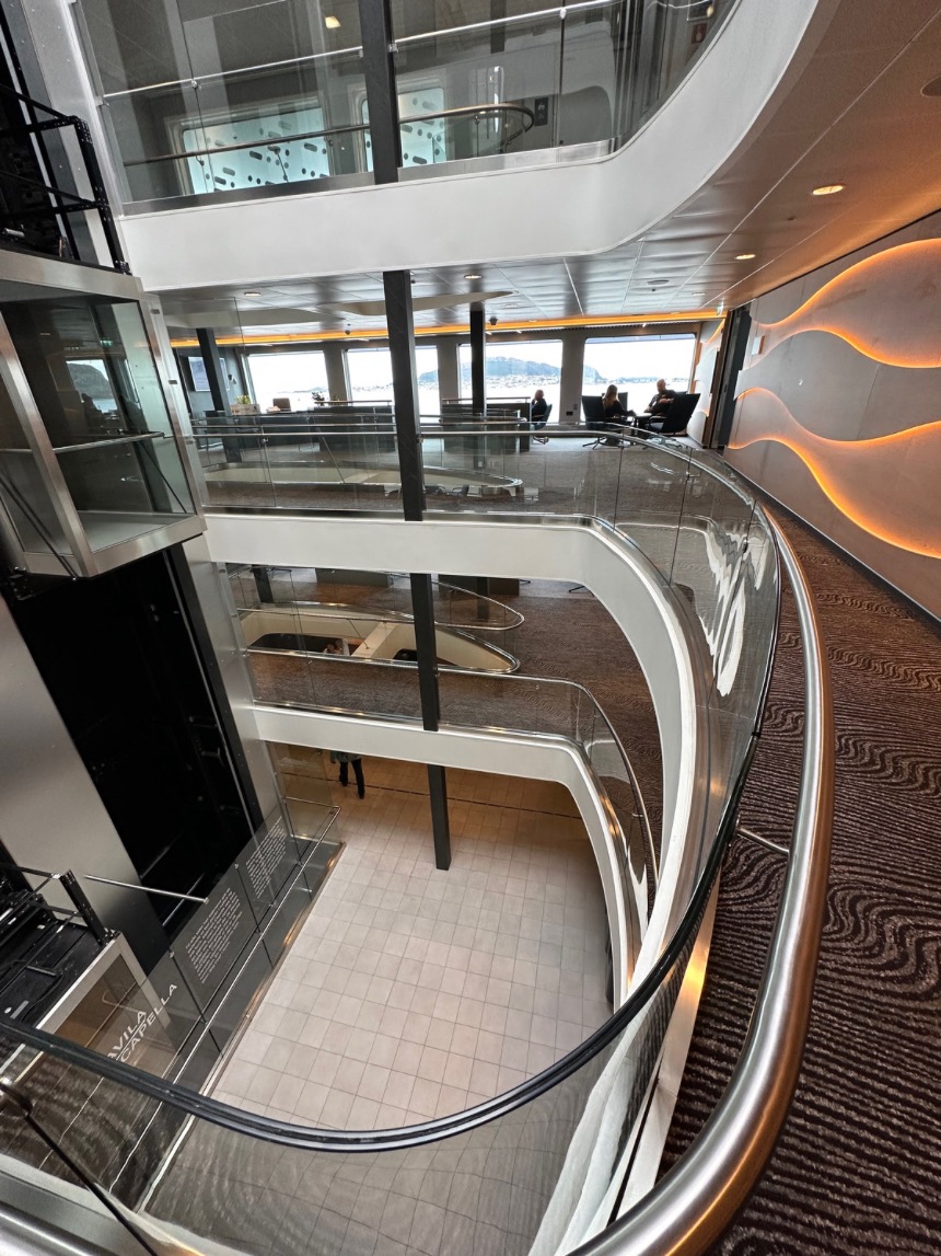 The impressive atrium and glass elevator of the Havila Capella.