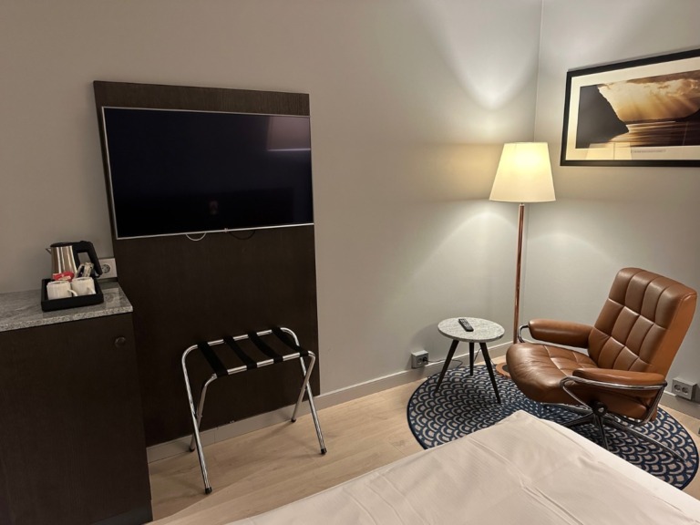 Armchair and TV in the guest room.