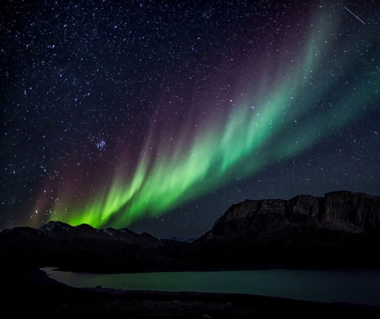 Aurora borealis against a starry sky.