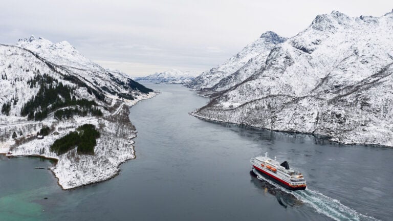 Hurtigruten cruise ship entering Trollfjord in Norway.
