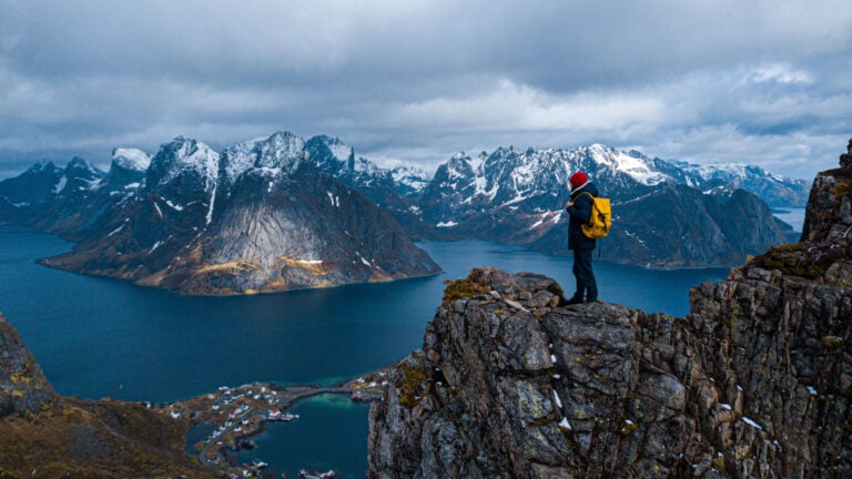 Lofoten Islands travel landscape with hiker.