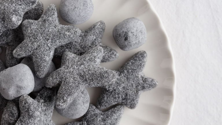 A white plate of salty liquorice from Scandinavia.