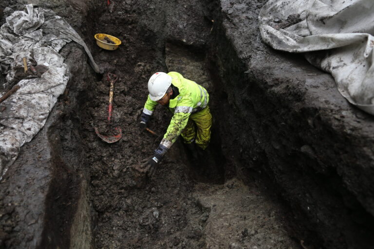 Archaeologist working at the pit where the game piece was found, nearly four meters below what is today's surface. Photo: Audun B. Selfjord, NIKU.