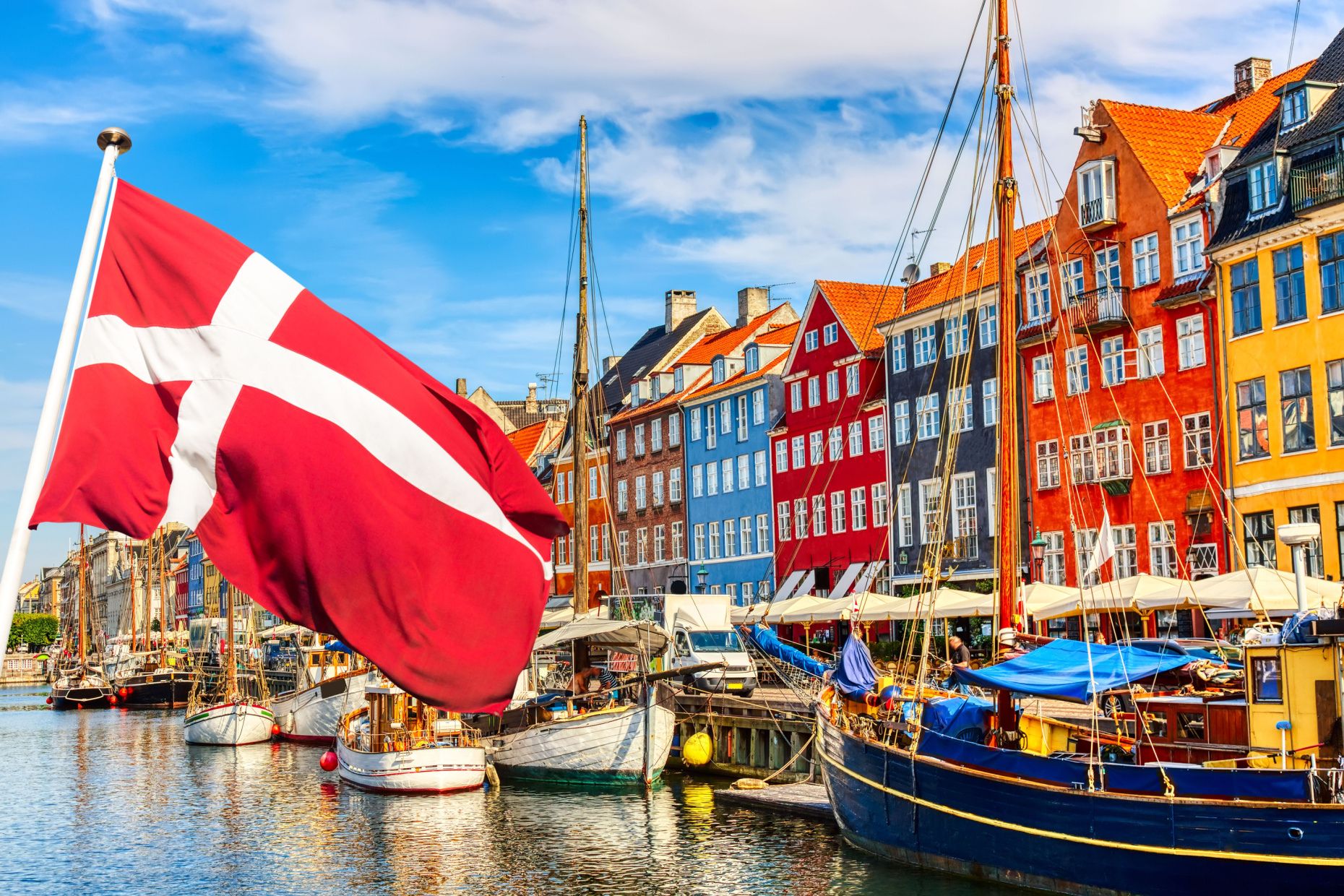 Copenhagen's Nyhavn canal with the Danish flag.