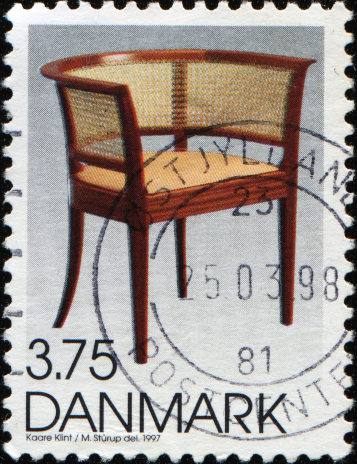 A Danish postage stamp featuring a chair by Kaare Klint Danish architect and furniture designer, circa 1997. Photo: IgorGolovniov / Shutterstock.com.