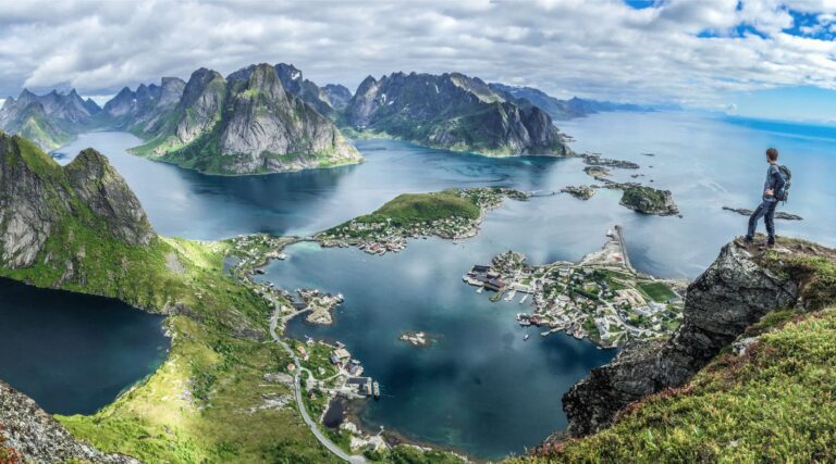 Hiker looking over Lofoten mountains.