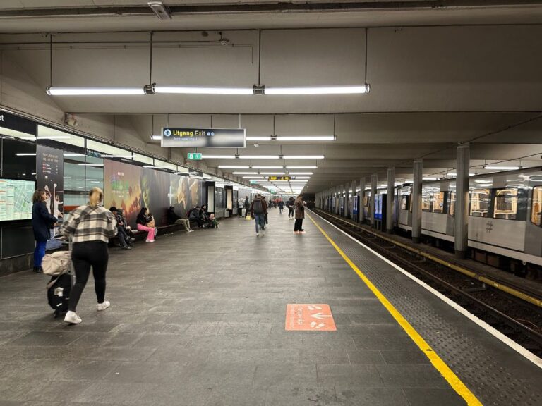 Waiting for a metro train on the wide platform at Jernbentorget in central Oslo.