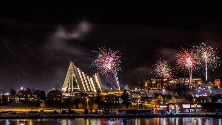 Fireworks over the Arctic Cathedral in Tromsø, Norway.