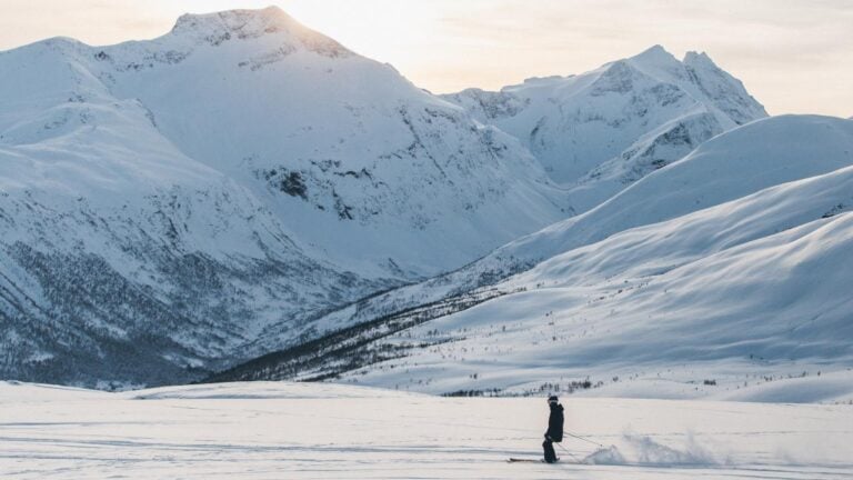 Skier in front of a mountain in Norway.