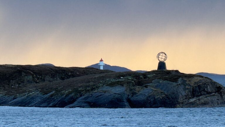 An Arctic Circle monument marker in Norway seen from a passing ship. Photo: David Nikel.