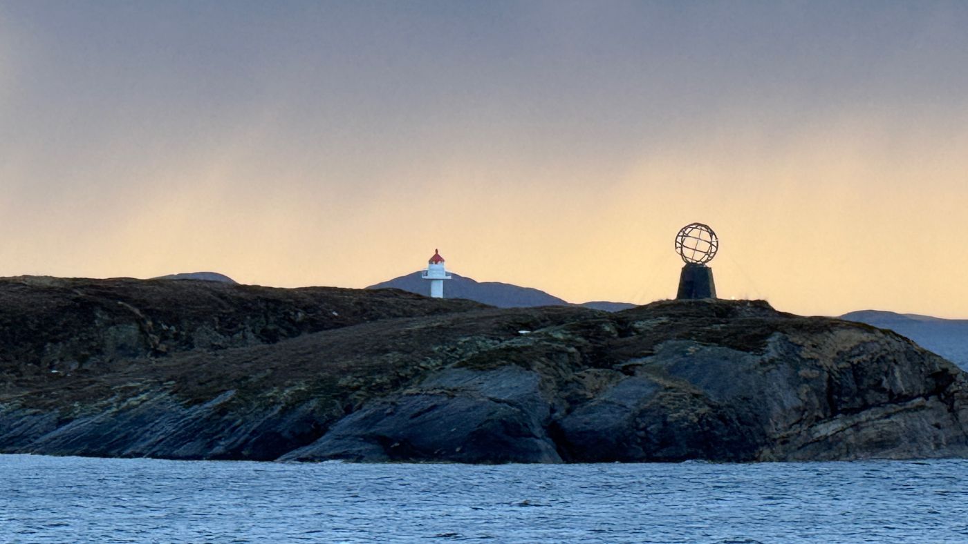 An Arctic Circle monument marker in Norway seen from a passing ship. Photo: David Nikel.