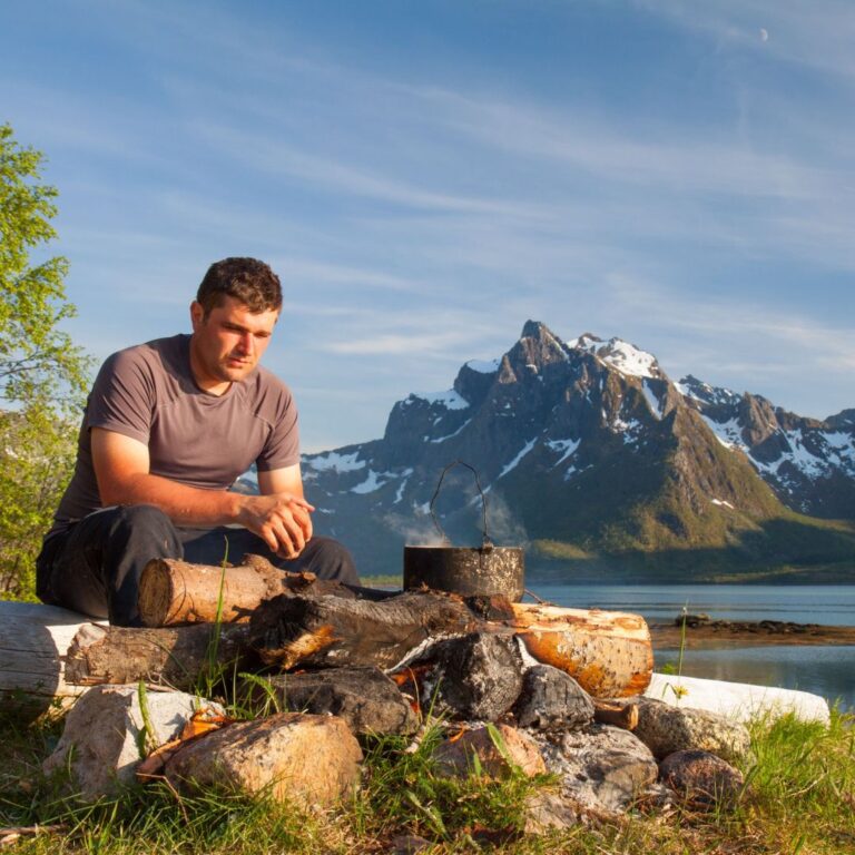 Man with campfire in Norway.