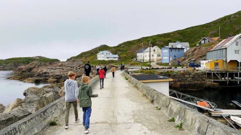 Tourists explore Nyksund. Photo: David Nikel.