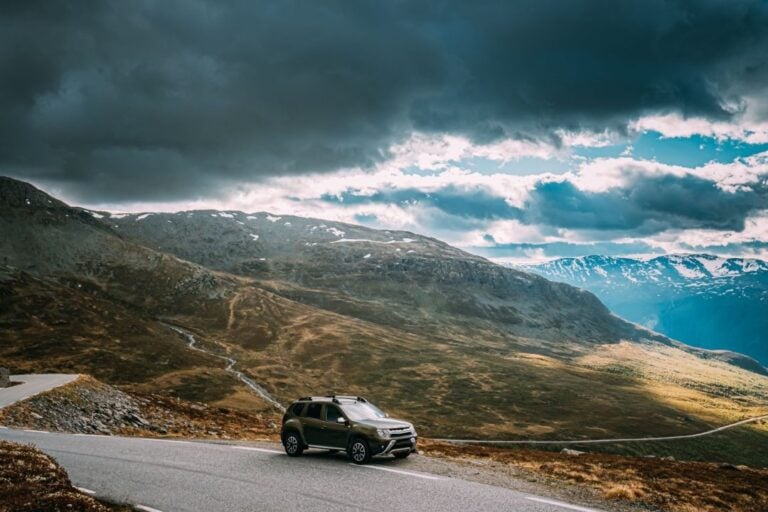 Car in the stormy Norwegian mountains.