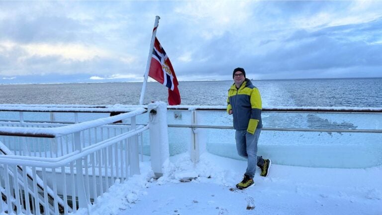 David Nikel in the snow at the back of deck 9 on Havila Polaris coastal cruise ferry in Norway.