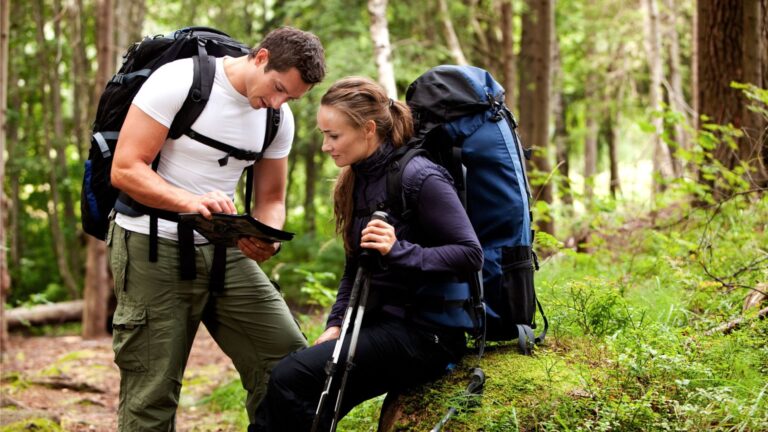 Hikers looking for a geocache in Norway.