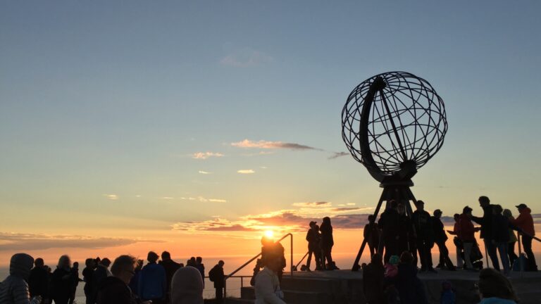 North Cape monument with the midnight sun in the summer. Photo: David Nikel.