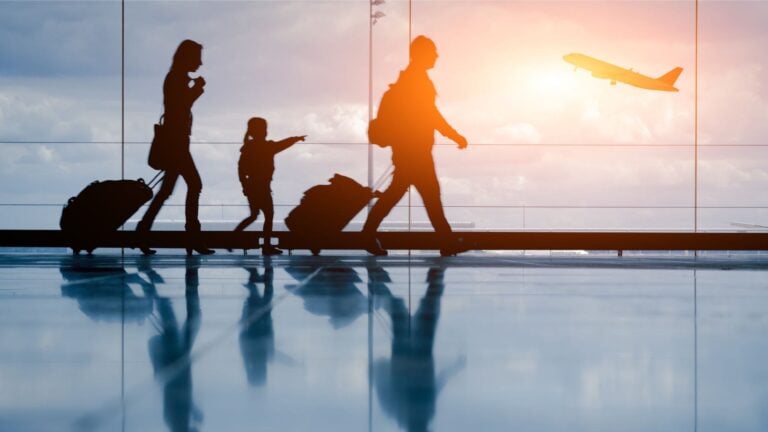 Family walking through an airport in Norway.