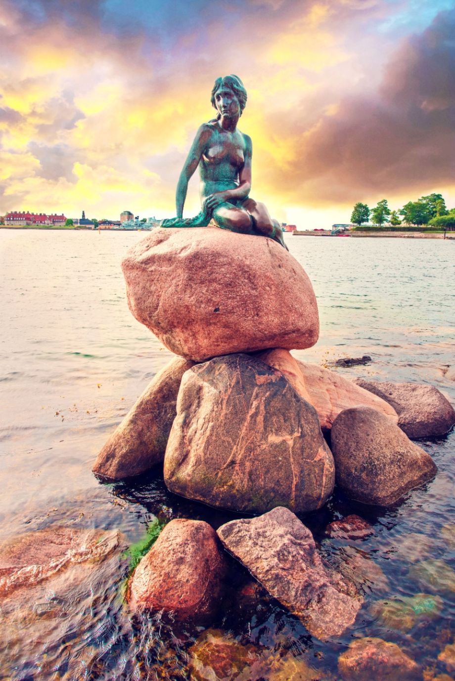 Famous bronze sculpture of a little mermaid in Copenhagen, Denmark. Photo: Andrij Vatsyk / Shutterstock.com.