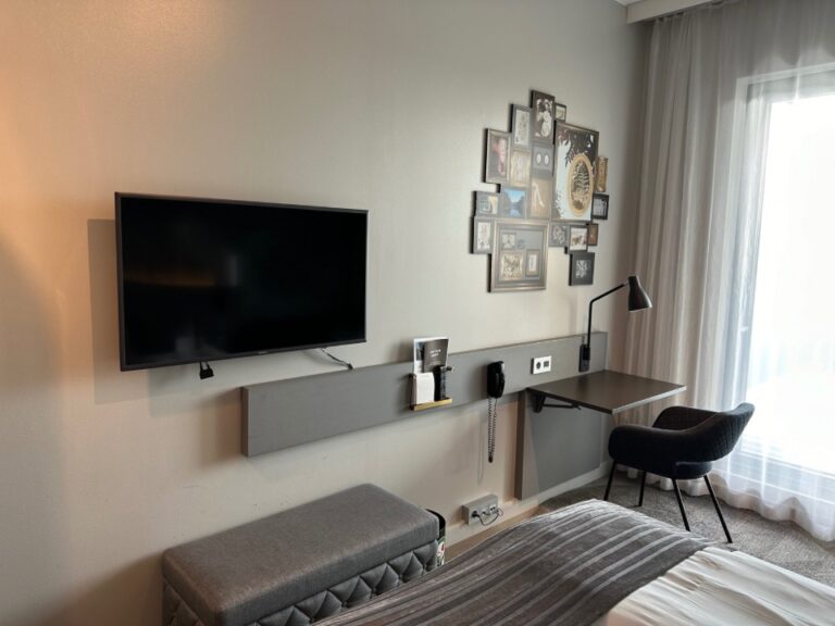Hotel room TV and desk.