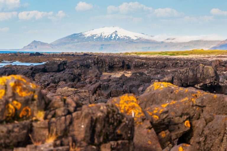 Volcanic landscape with mountain background of Snæfellsjökull glacier on Iceland's Snæfellsnes peninsula.