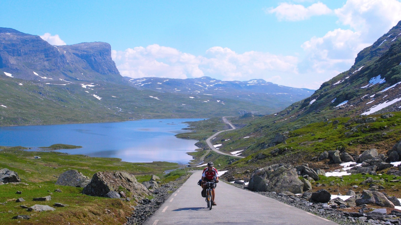 Cyclist on a road in Fjord Norway.
