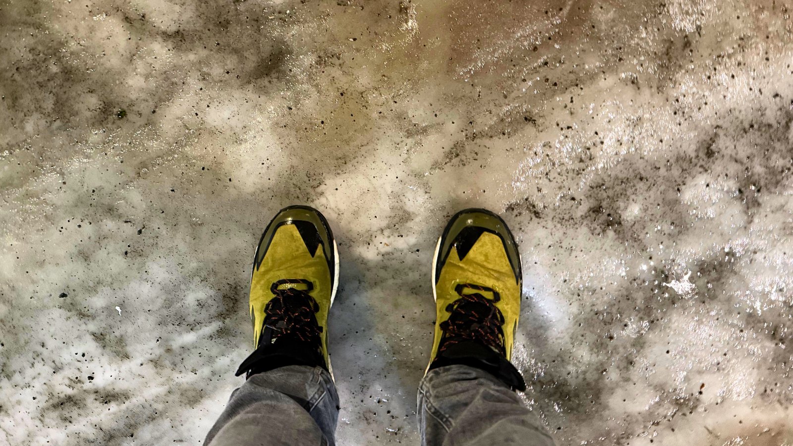 Two yellow shoes on ice in Norway.