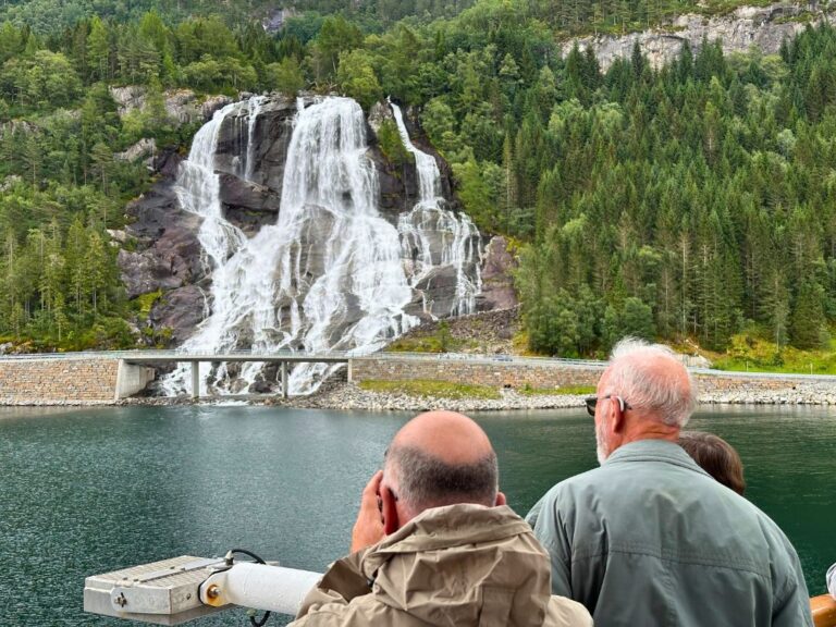 Fred Olsen Balmoral cruise ship approaches waterfall. Photo: David Nikel.